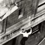 Hands Through the Sewer Grate